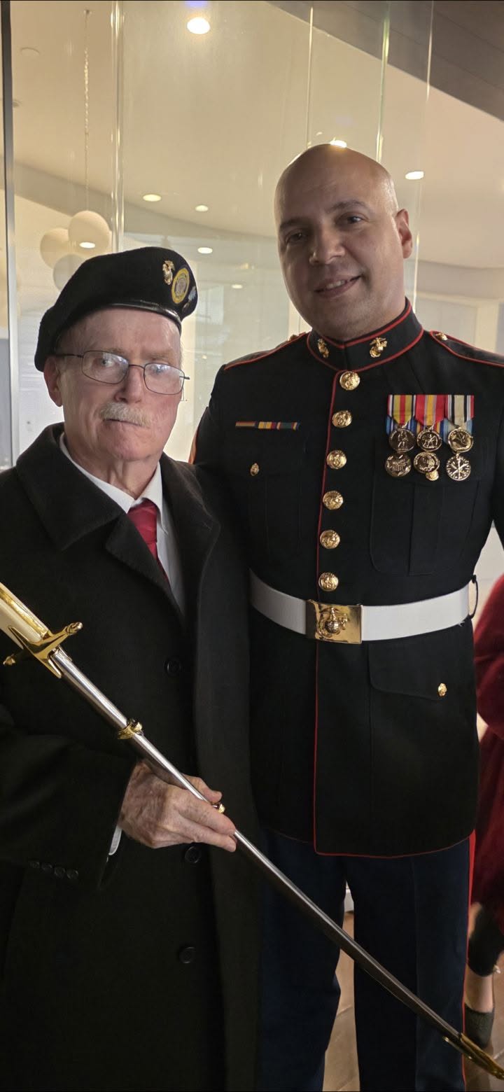Daniel Guzman with a fellow Marine Corps veteran at a ceremony